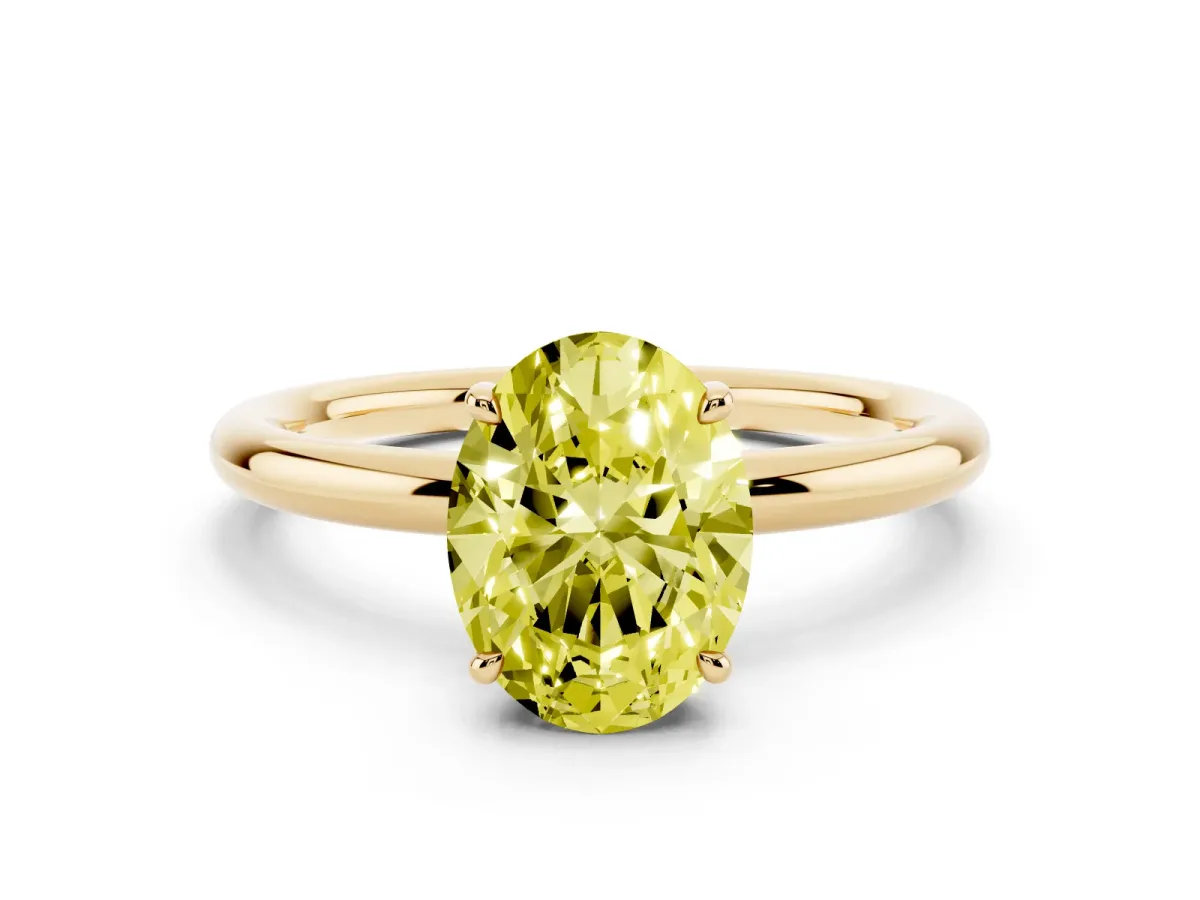 Fancy Yellow Oval Cut Diamond Solitaire Ring with Thin Band and Four-Prong Setting Yellow gold