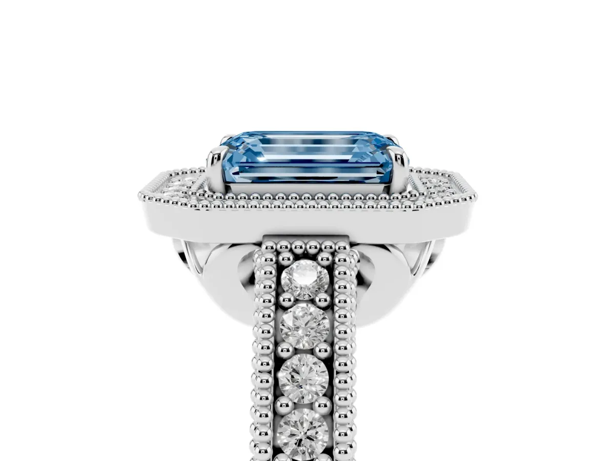 Fancy Blue Emerald Cut Cut Halo Diamond Ring with Pavé Band and Four-Prong Setting White gold