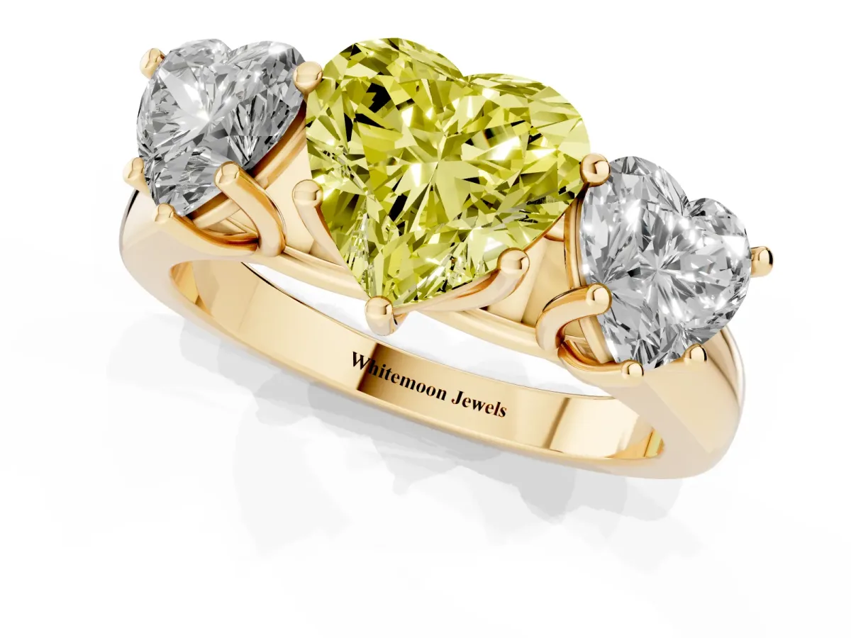 Fancy Yellow Heart Cut Three-Stone Diamond Ring with Prong Setting on a Classic Band Yellow gold