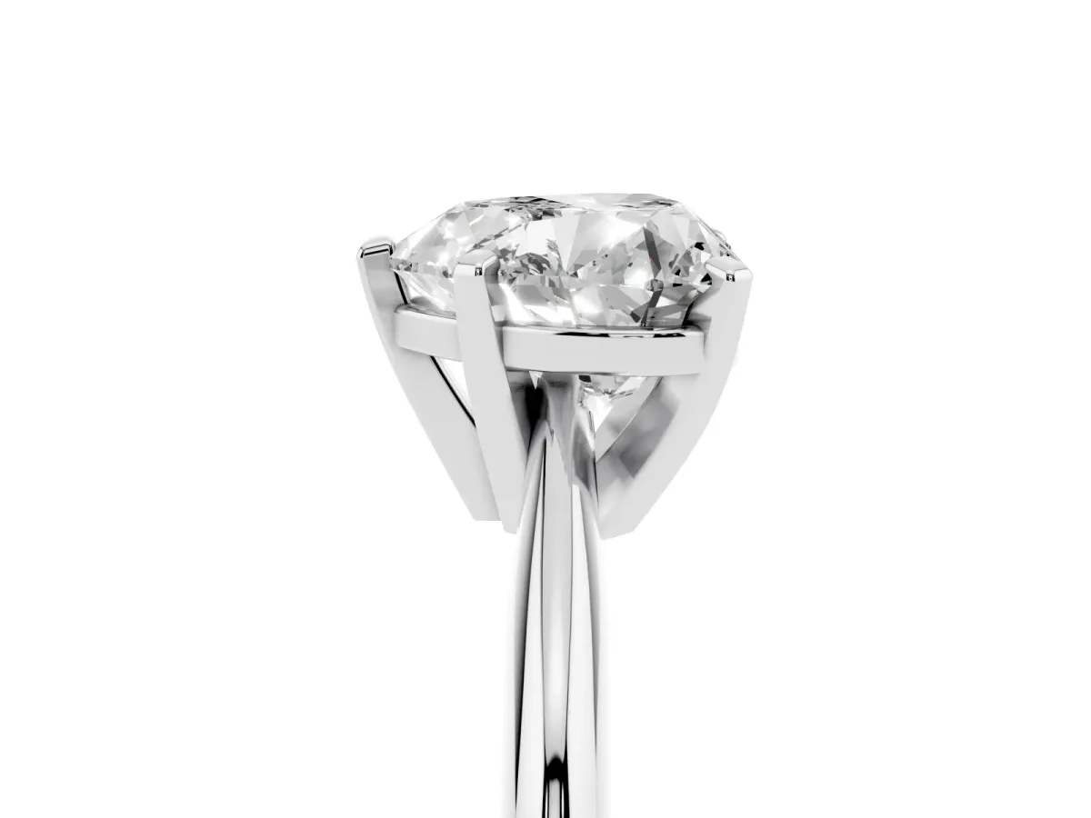 Heart Cut Cut Solitaire Ring with Four-Prong Setting on a Classic Band Silver