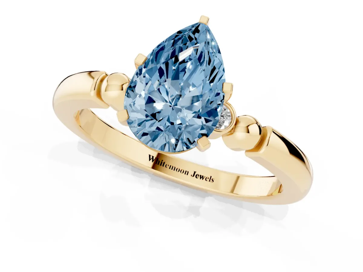 Fancy Blue Pear Cut Solitaire Beaded Band with Four-Prong Setting Yellow gold