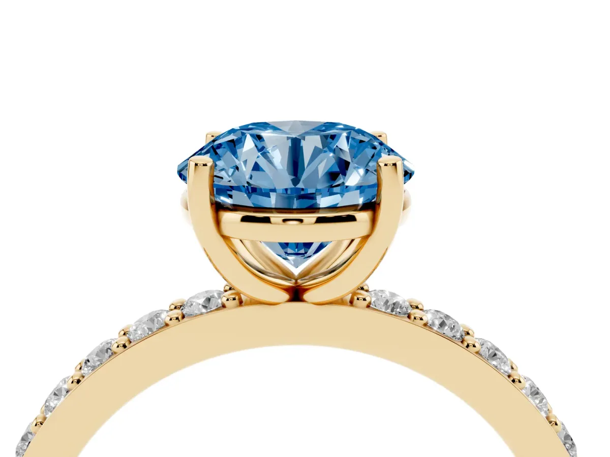 Fancy Blue Round Cut Cut Diamond Solitaire with Pave Band and Four-Prong Setting Yellow gold