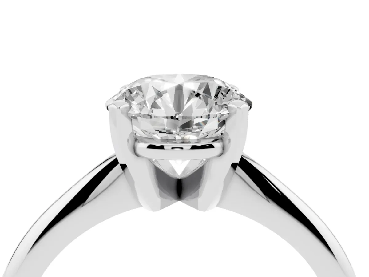 Round Cut Cut Solitaire Ring with Four-Prong Setting on a Classic Band Silver