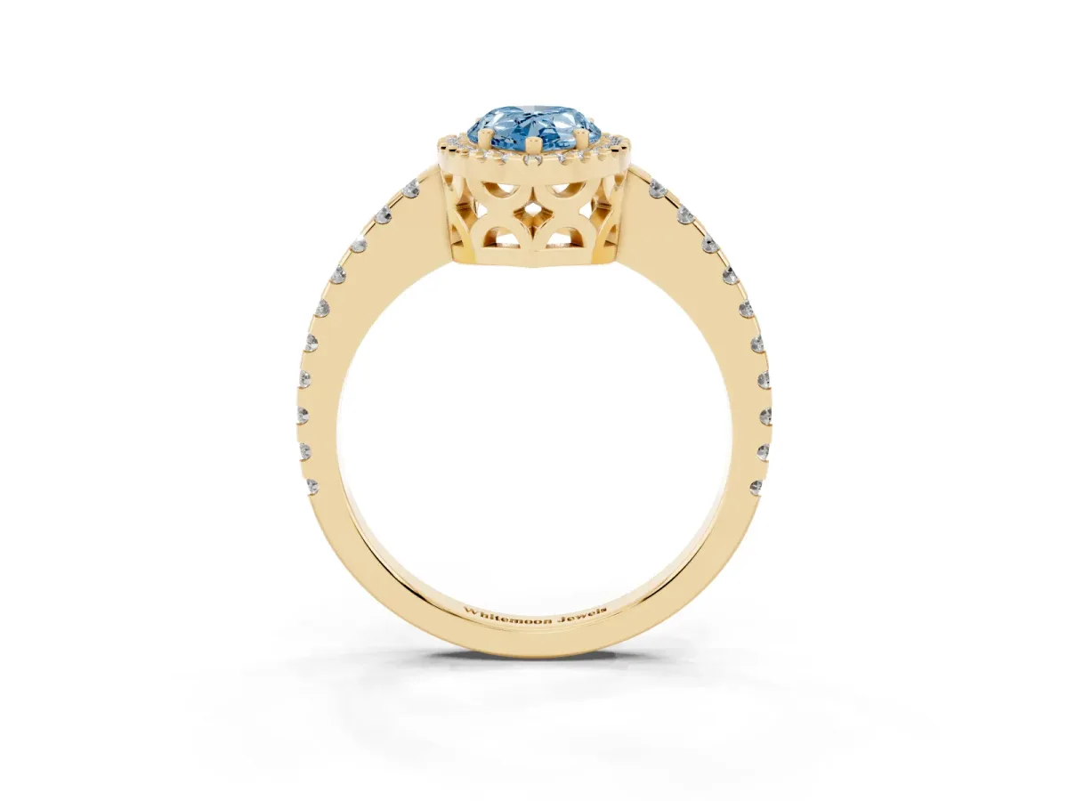 Fancy Blue Pear Cut Diamond Halo Engagement Ring with Pavé Band and Prong Setting Yellow gold