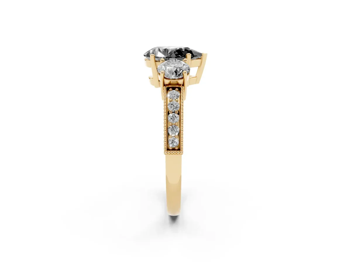 Fancy Black Pear Cut Three-Stone Diamond Ring with Pavé Band and Four-Prong Setting Yellow gold