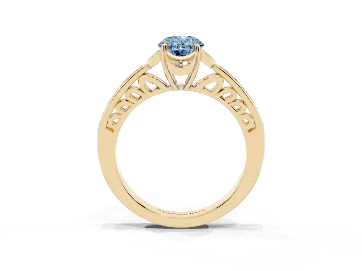 Fancy Blue Oval Cut Cut Halo Diamond Ring with Channel Set Band and Four-Prong Setting Yellow gold