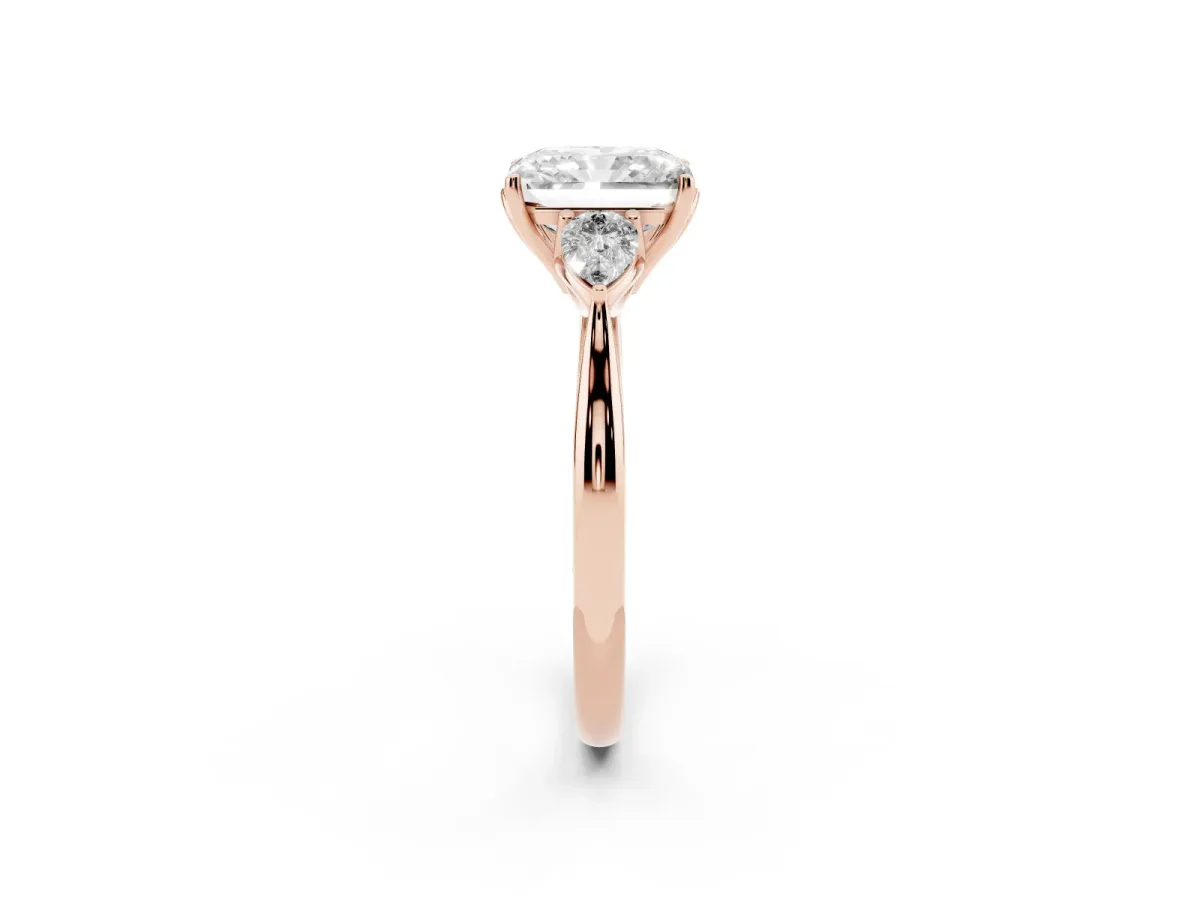 Three-Stone Radiant Cut Diamond Ring with Pear Side Stones in Four-Prong Setting Rose gold