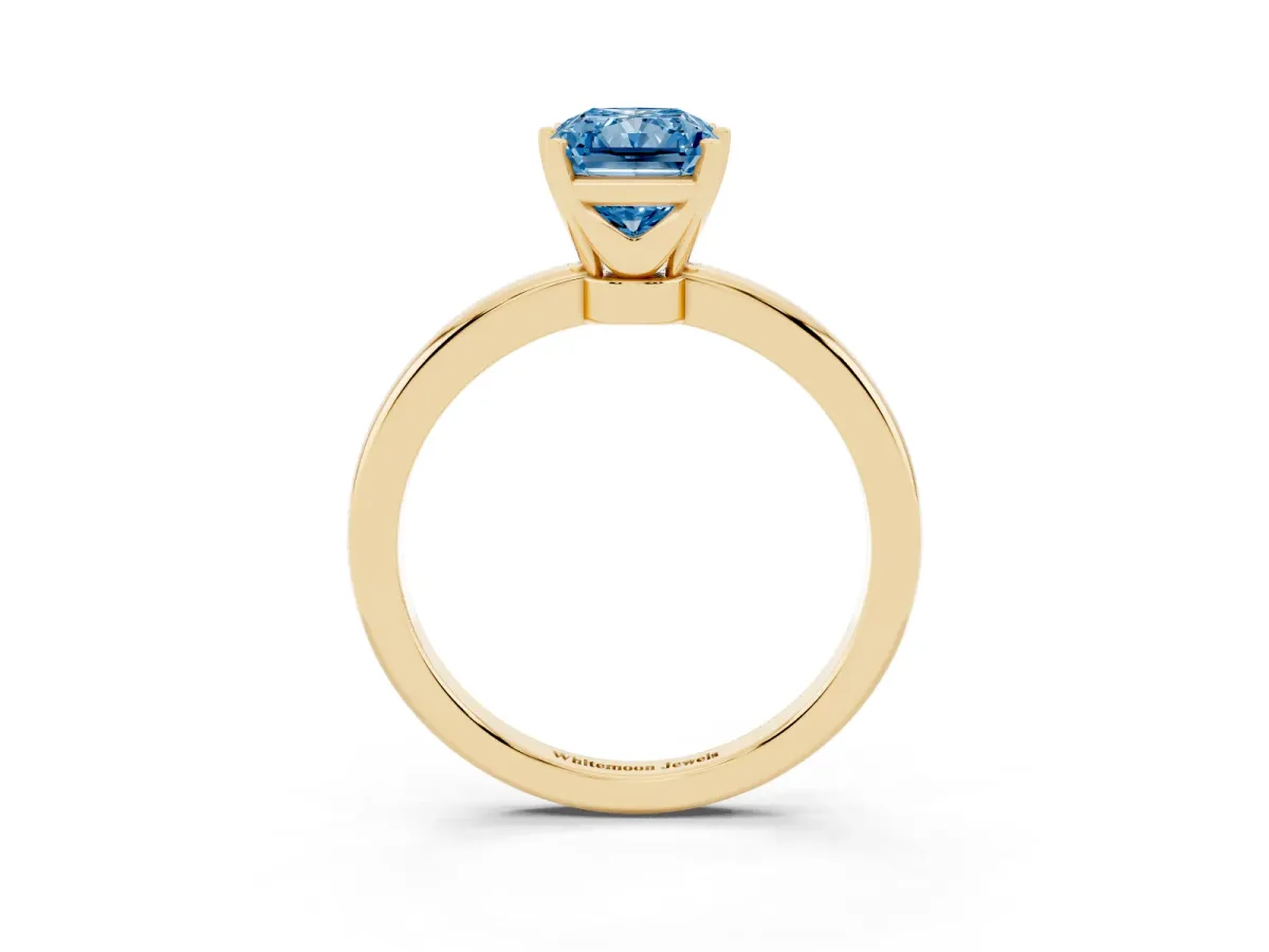 Fancy Blue Radiant Cut Solitaire Diamond Ring with Six-Prong Setting on a Classic Band Yellow gold