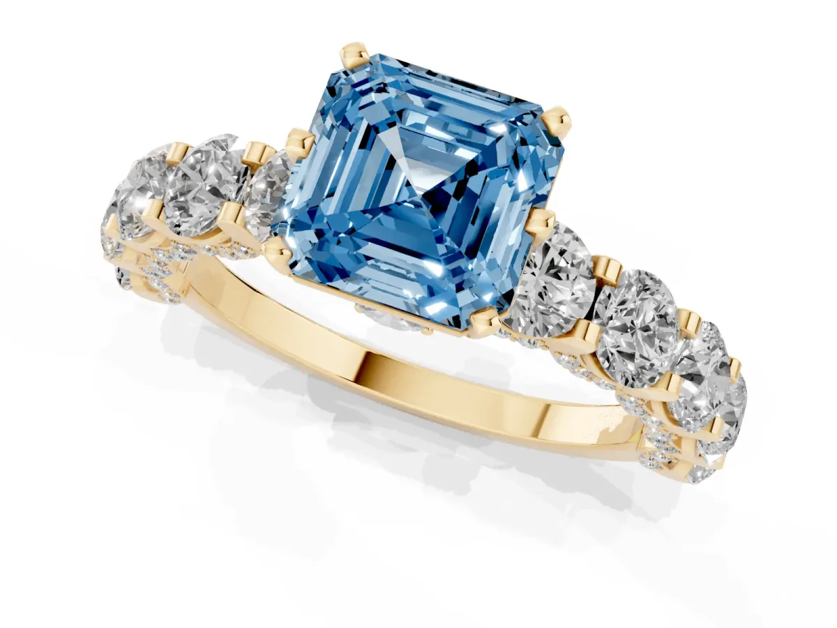 Fancy Blue Asscher Cut Diamond Side Stone Engagement Ring with Four-Prong Setting Yellow gold