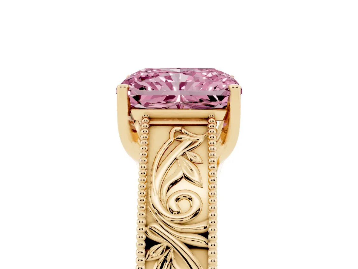 Fancy Pink Radiant Cut Diamond Solitaire Ring with Engraved Band and Four-Prong Setting Yellow gold
