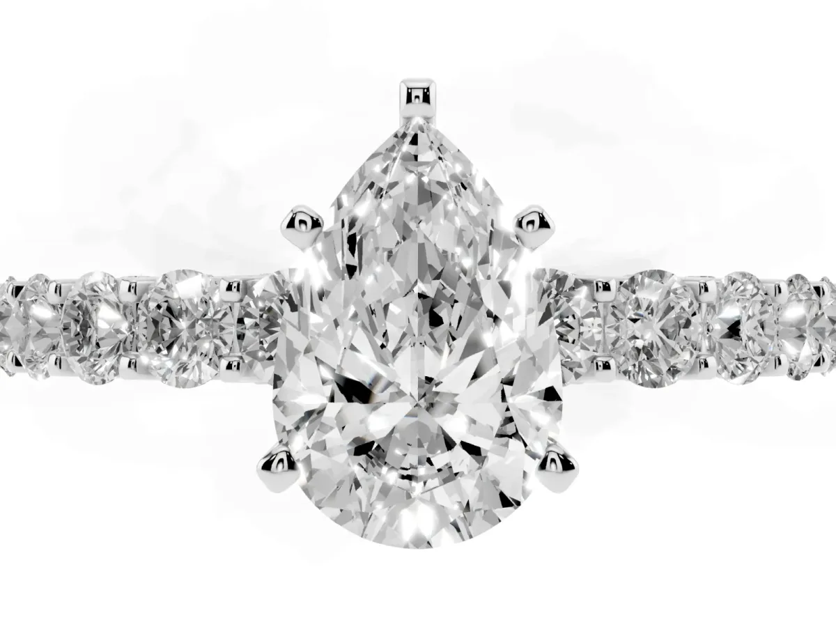 Pear Cut Diamond Solitaire Ring with Shared Prong Pavé Band and Four-Prong Setting Silver