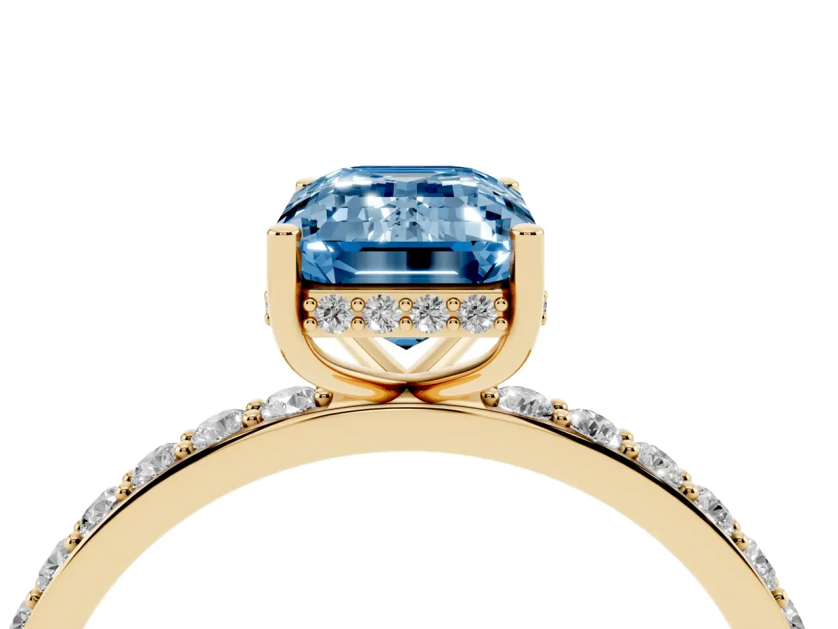 Fancy Blue Emerald Cut Diamond Solitaire Ring with Pavé Band and Hidden Halo Yellow gold