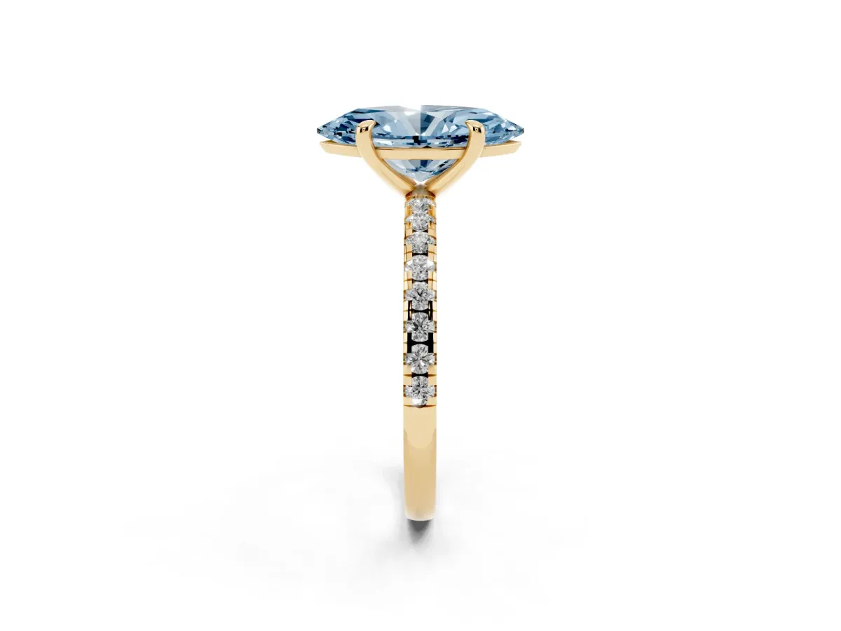 Fancy Blue Marquise Cut Diamond Brilliant Solitaire Ring with Pavé Band and Four-Prong Setting Yellow gold