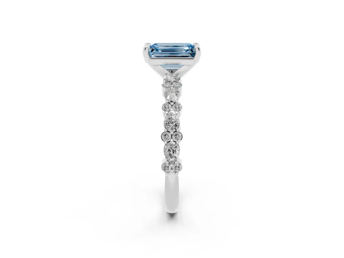 Fancy Blue Emerald Cut Diamond Side Stone Solitaire Ring with Round and Four-Prong Setting White gold