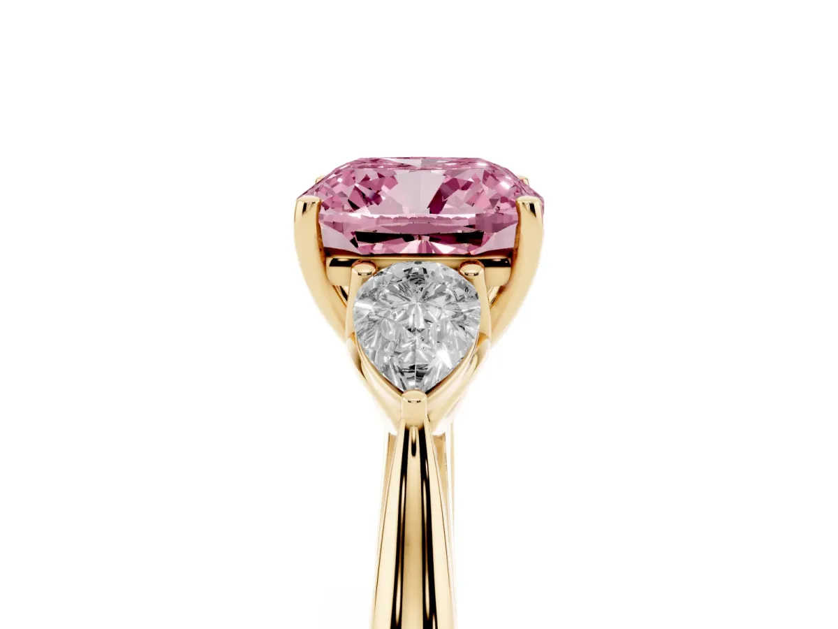 Fancy Pink Three-Stone Cushion Cut Diamond Ring with Pear Side Stones in Four-Prong Setting Yellow gold