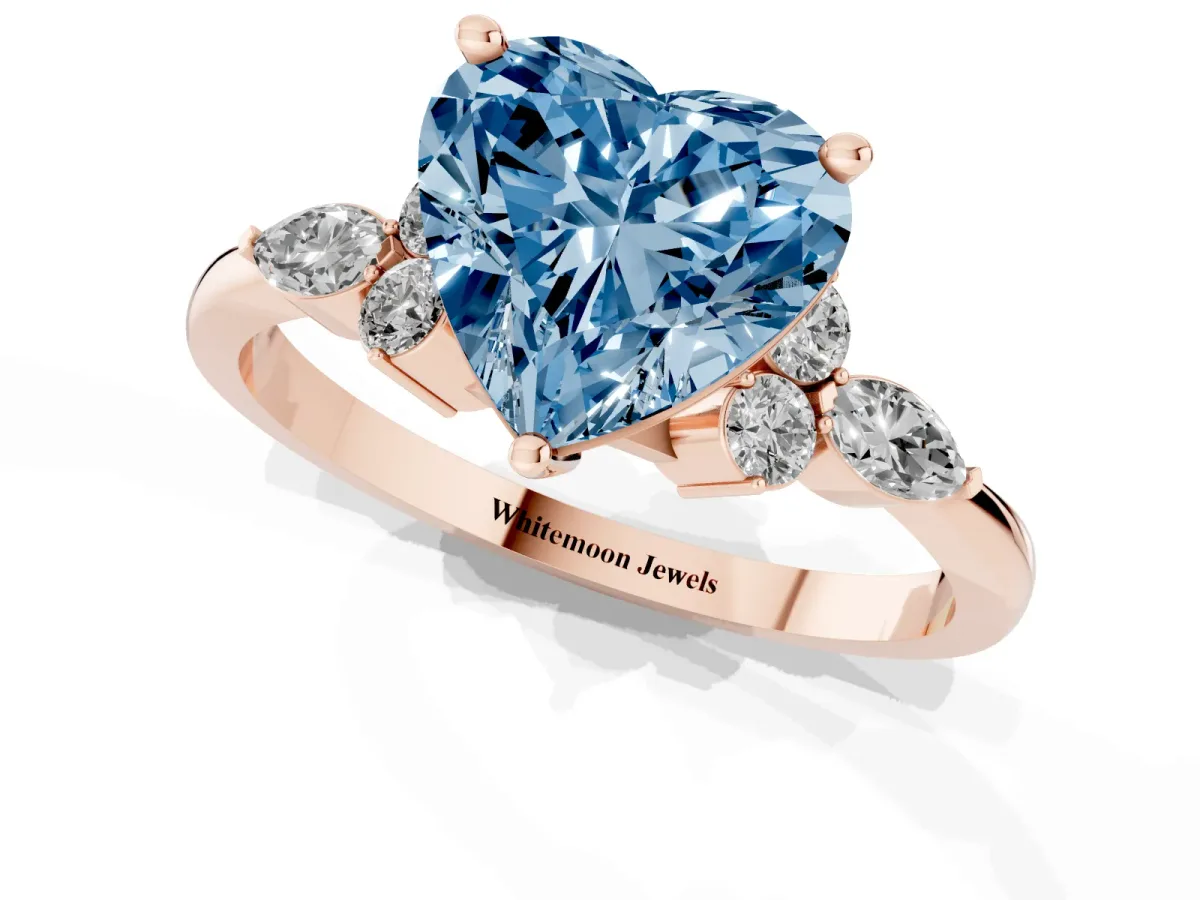 Fancy Blue Heart Cut Brilliant Diamond Solitaire Ring with Pear Side Stones and Four-Prong Setting Rose gold