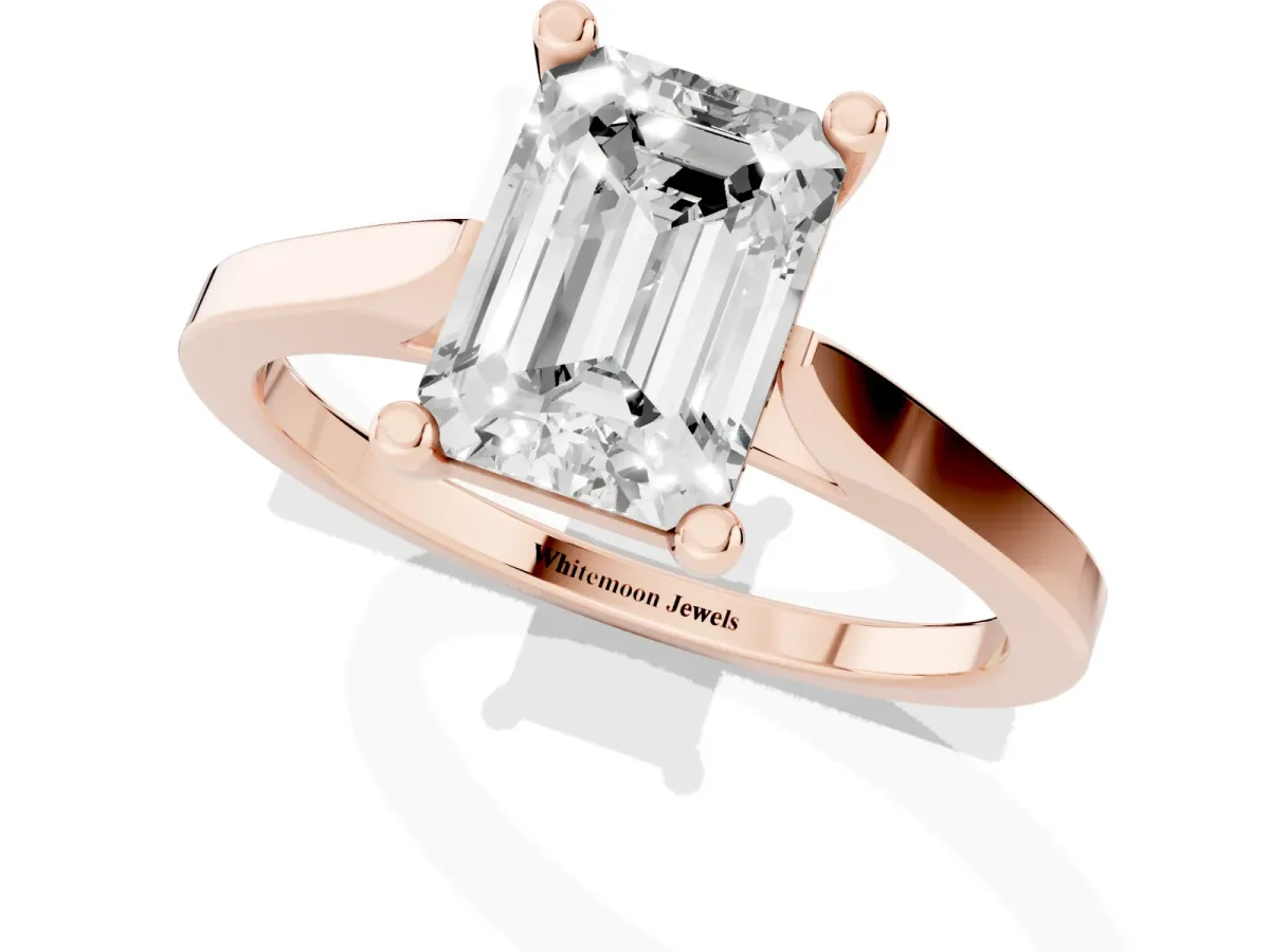 Emerald Cut Solitaire Diamond Ring with Four-Prong Setting and Tapered Band Rose gold
