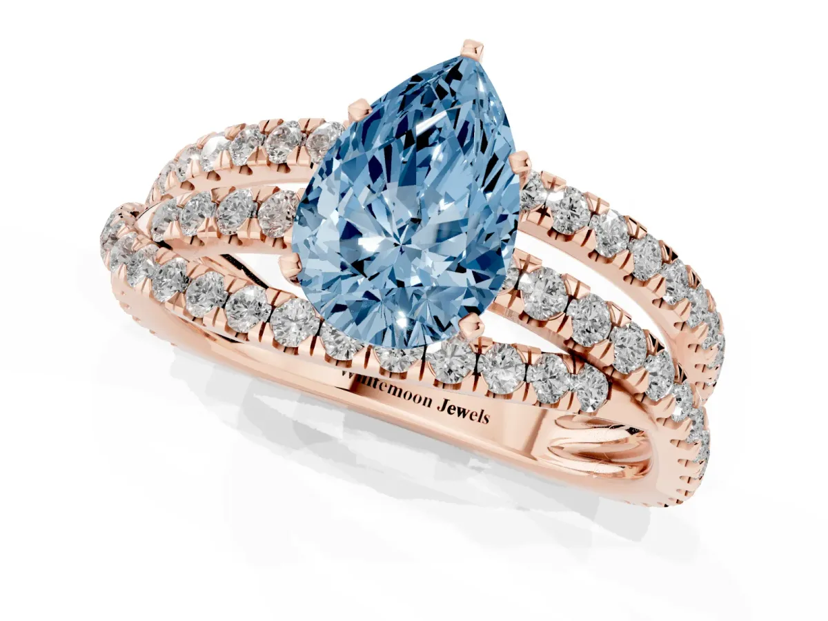 Fancy Blue Pear Cut Solitaire Twist Band with Pavé Setting and Four-Prong Setting Rose gold