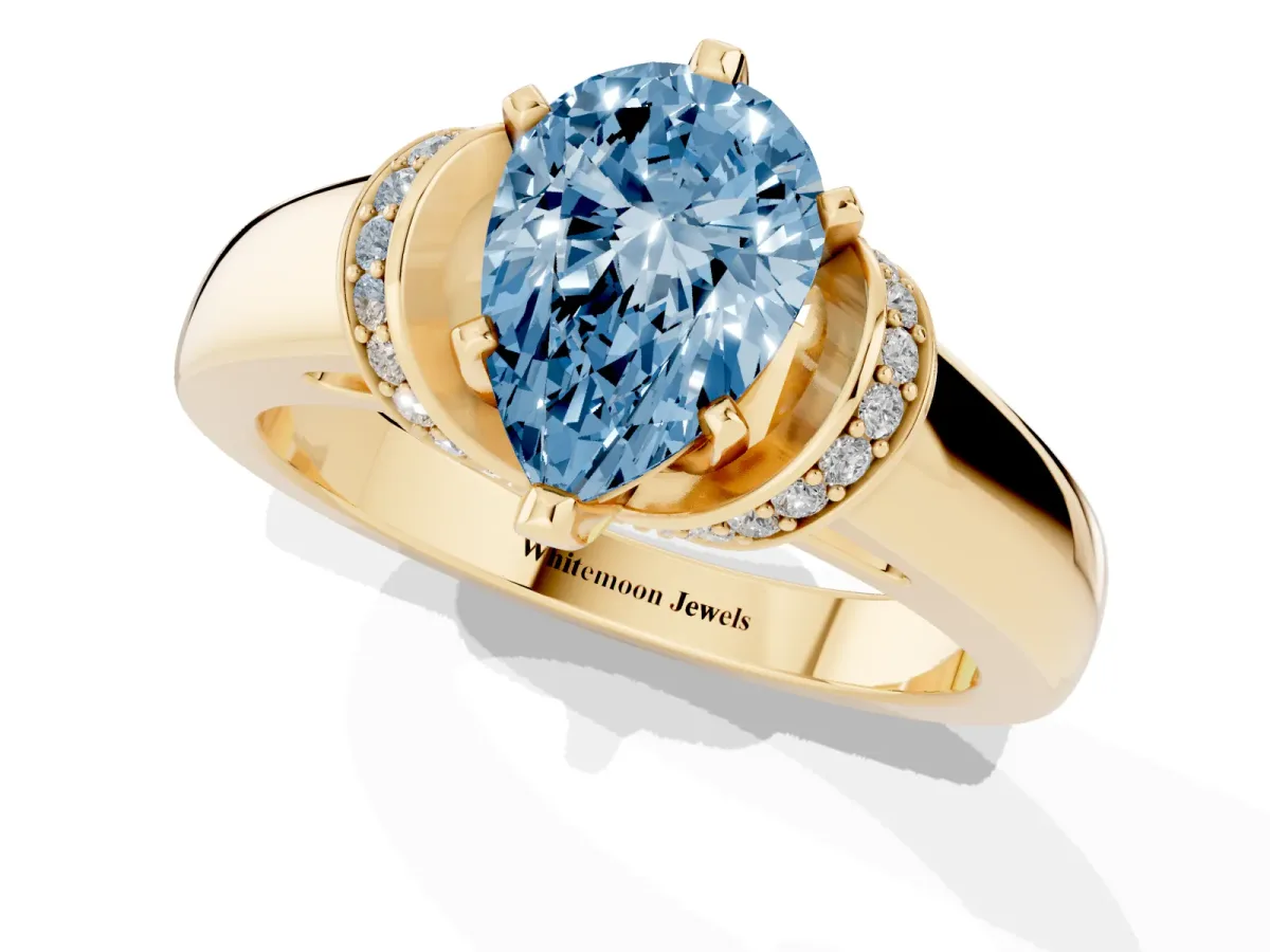 Fancy Blue Pear Cut Solitaire Diamond Ring with Pave Band and Six-Prong Setting Yellow gold