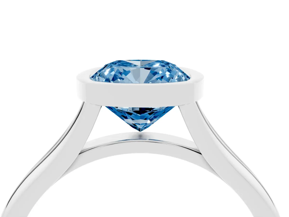 Fancy Blue Bezel Set Cushion Cut Cut Solitaire Ring with Tapered Band Silver