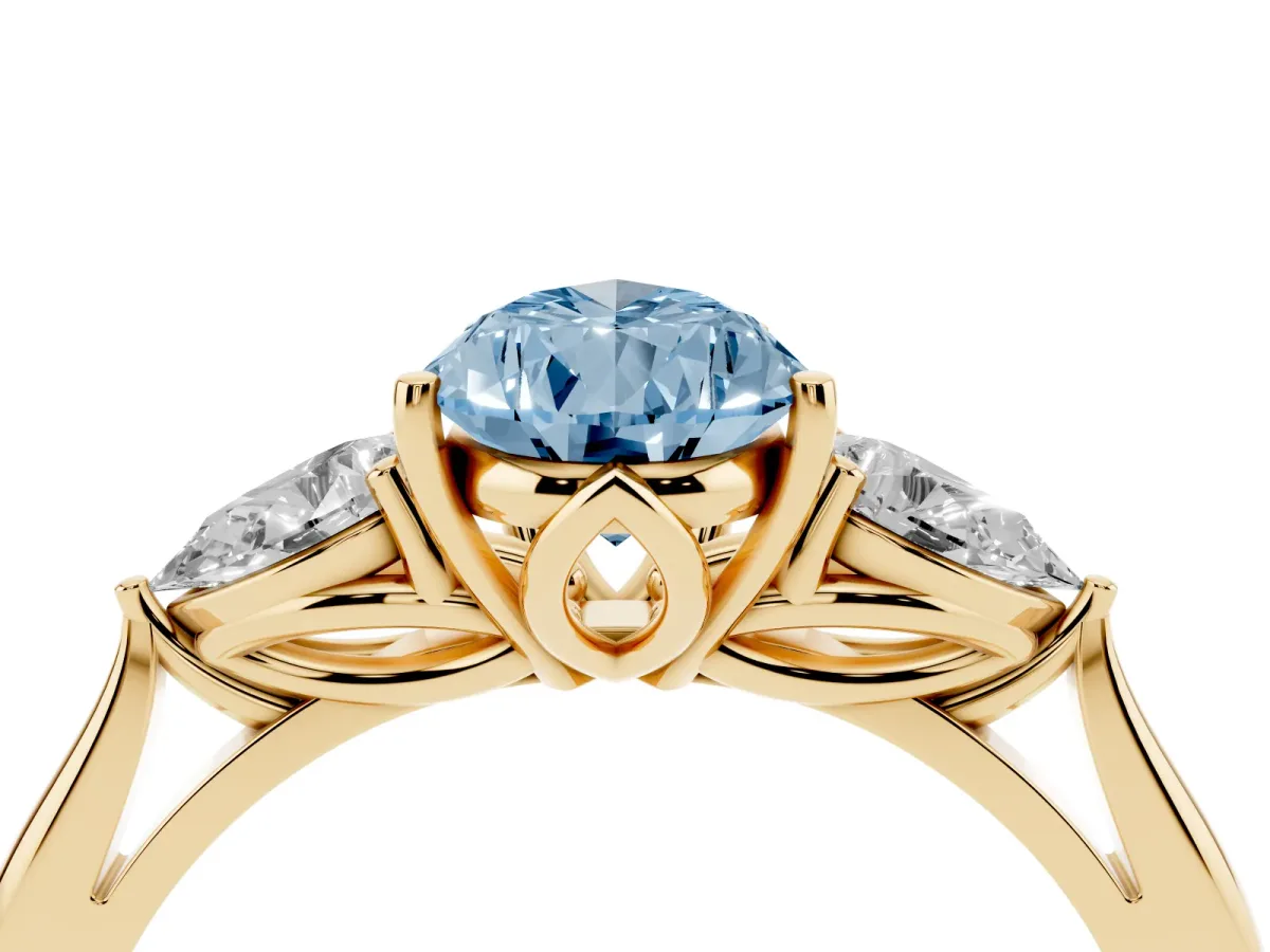 Fancy Blue Three-Stone Pear Cut Diamond Ring with Pear Side Stones in Four-Prong Setting Yellow gold