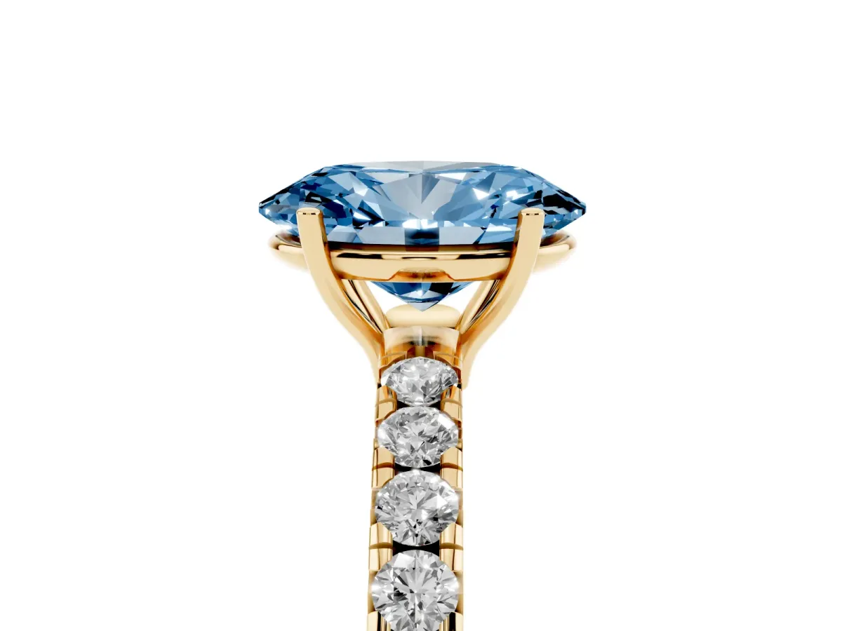 Fancy Blue Oval Cut Diamond Pavé Solitaire Engagement Ring with Four-Prong Setting Yellow gold