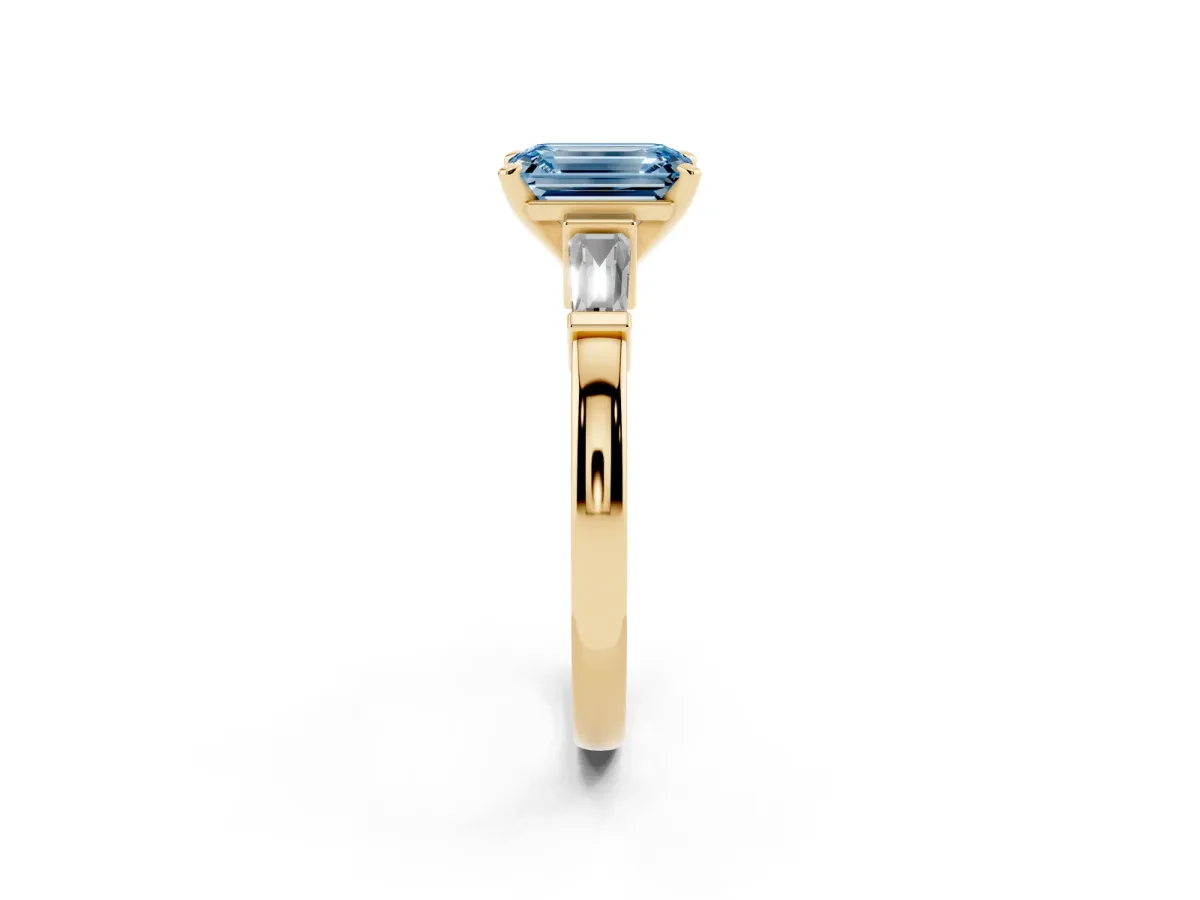 Fancy Blue Emerald Cut Cut Diamond Solitaire Ring with Tapered Baguette Accents and Four-Prong Setting Yellow gold