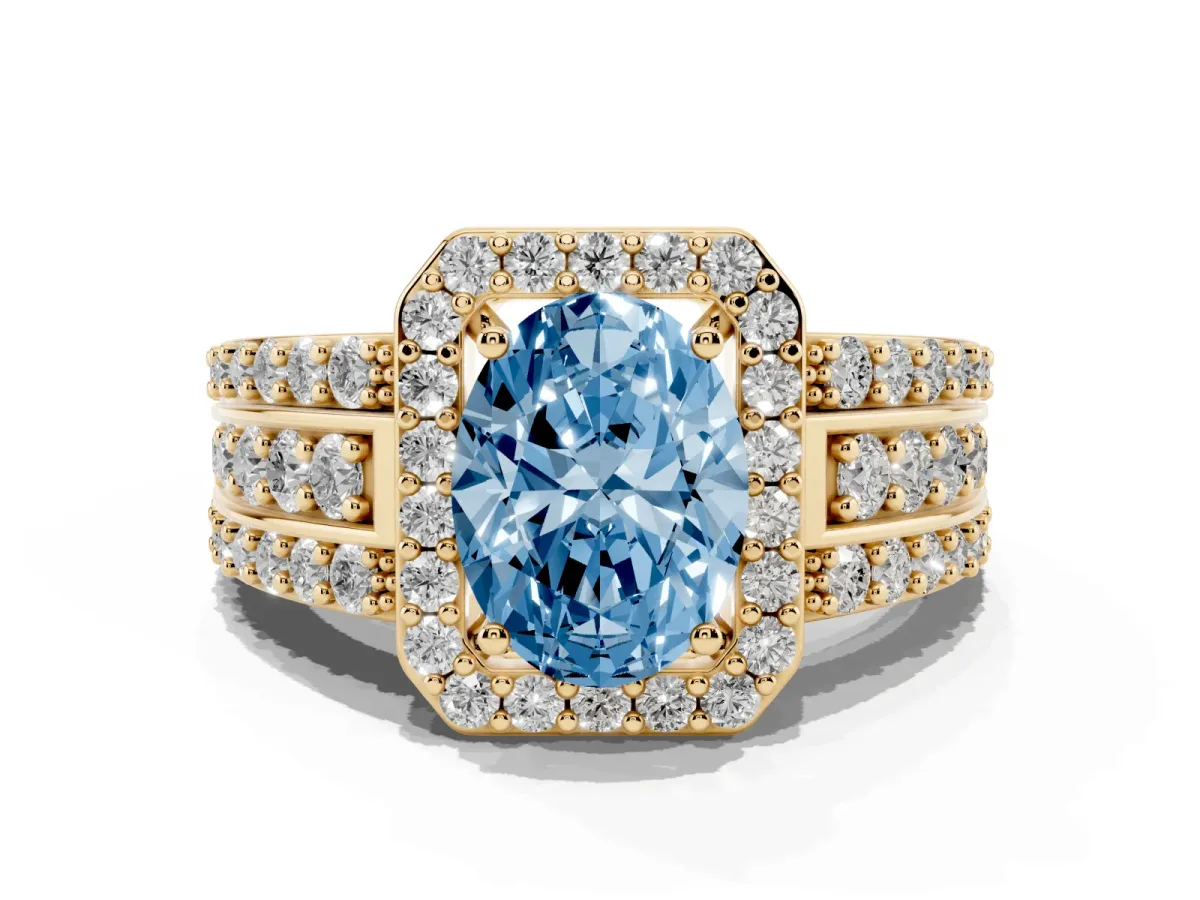 Fancy Blue Oval Cut Halo Diamond Ring with Round Split Shank and Prong Setting Yellow gold