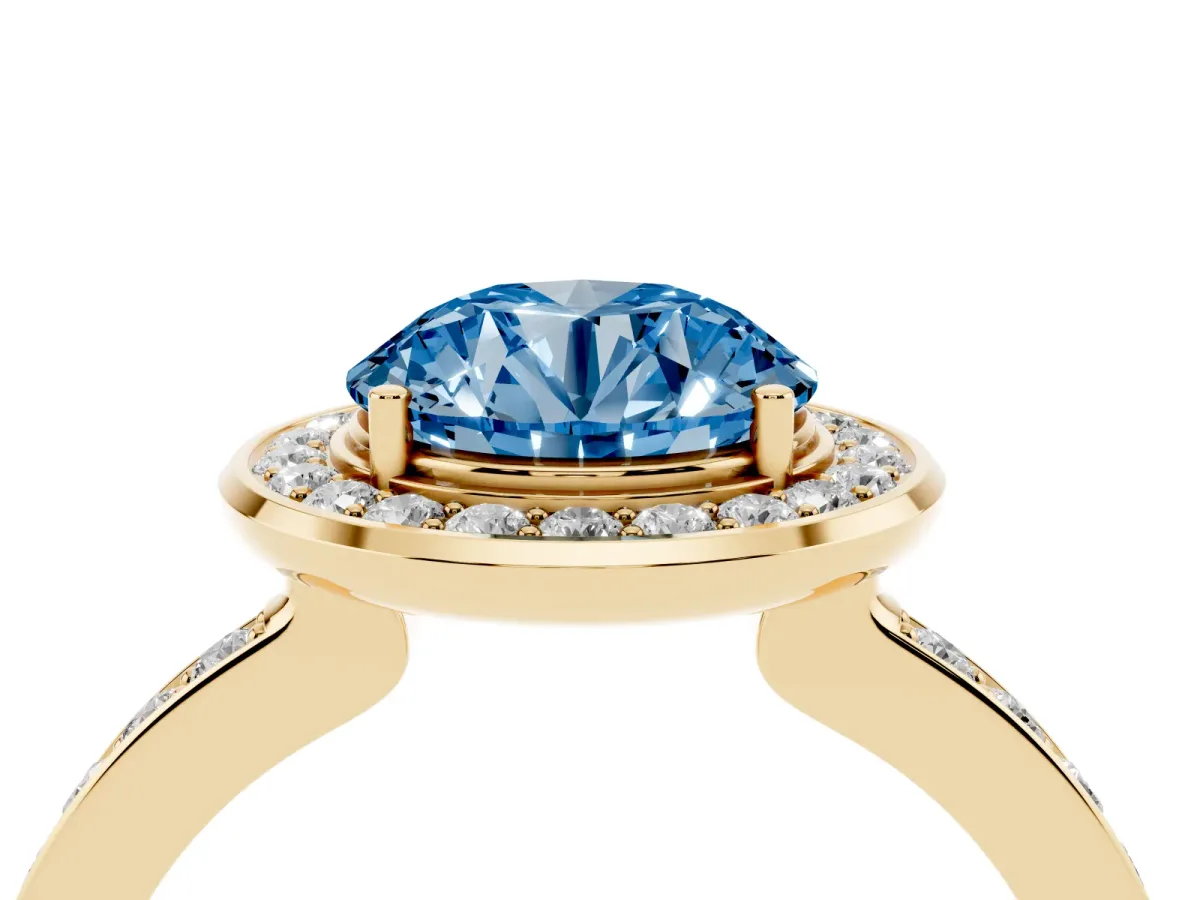 Fancy Blue Round Cut Diamond Halo Ring with Bezel Frame and Pavé Band Yellow gold