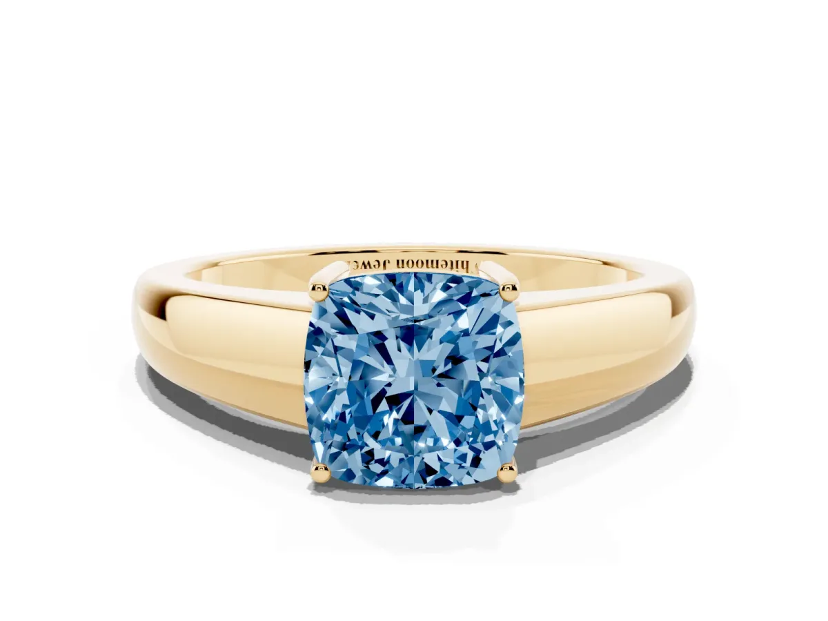 Fancy Blue Cushion Cut Solitaire Diamond Ring with Tapered Band and Four-Prong Setting Yellow gold