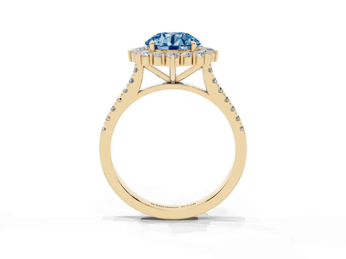 Fancy Blue Round Cut Halo Diamond Ring with Pavé Band and Prong Setting Yellow gold