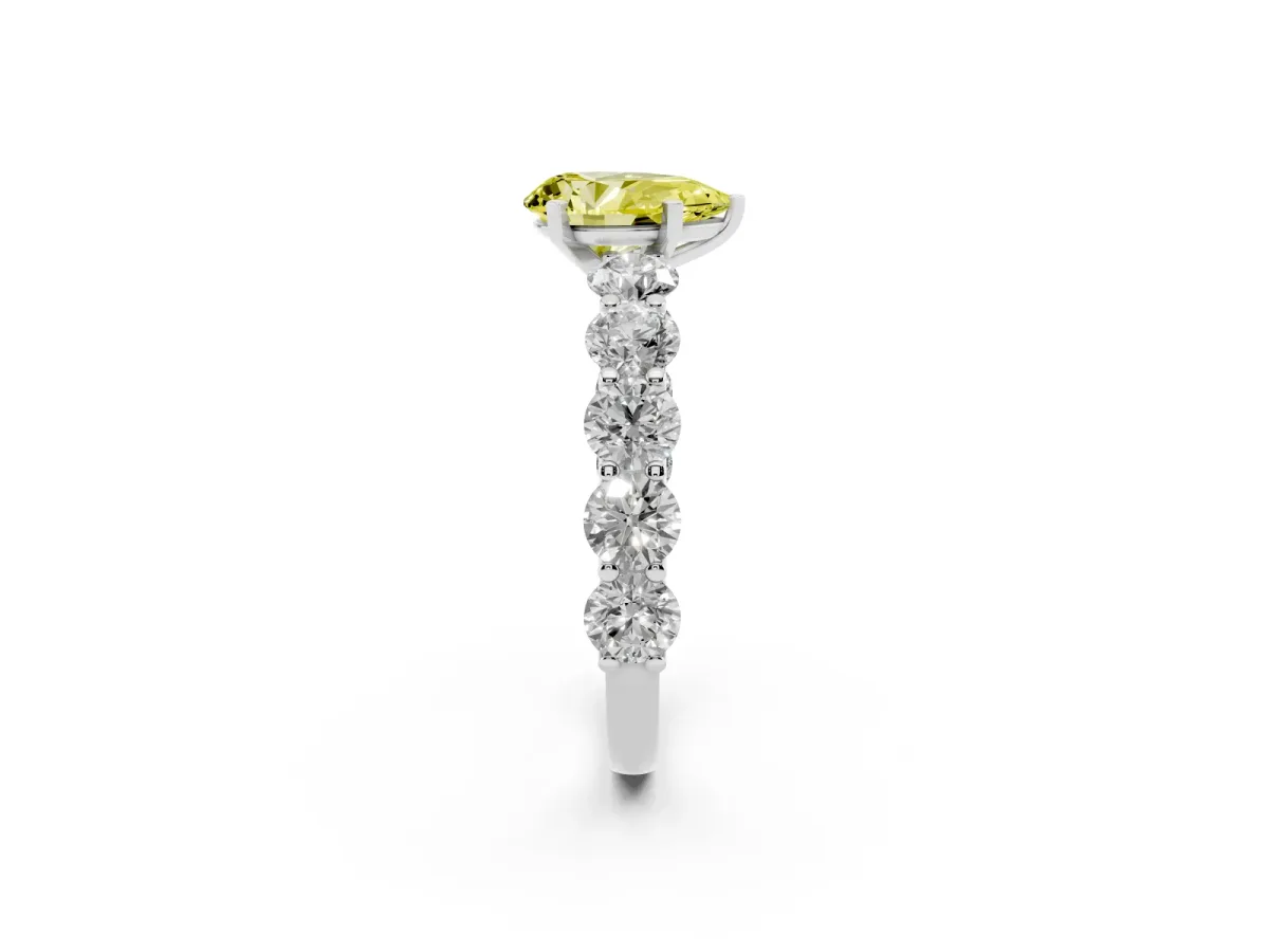 Fancy Yellow Pear Cut Diamond Prong Setting with Side Stones on a Pave Band Silver