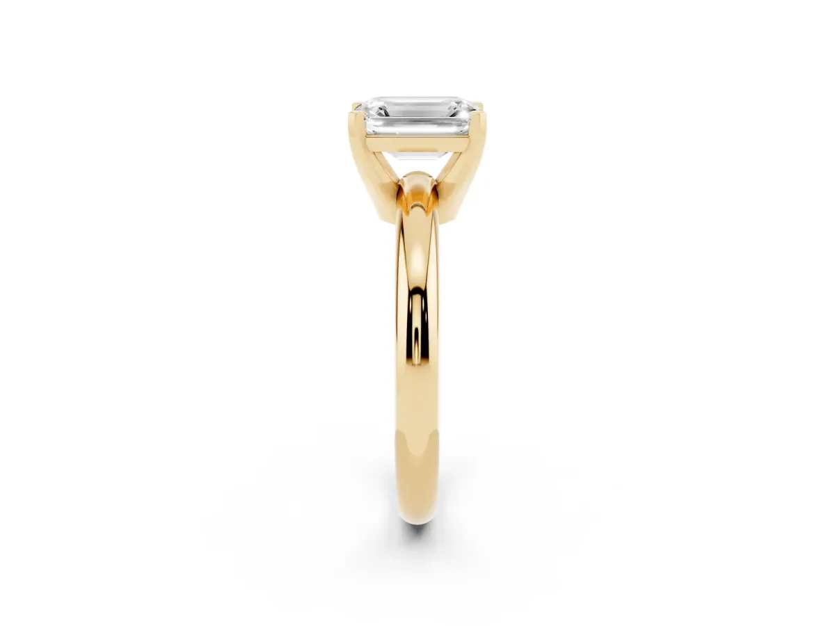 Emerald Cut Diamond Solitaire Engagement Ring with Round Band and Four-Prong Setting Yellow gold