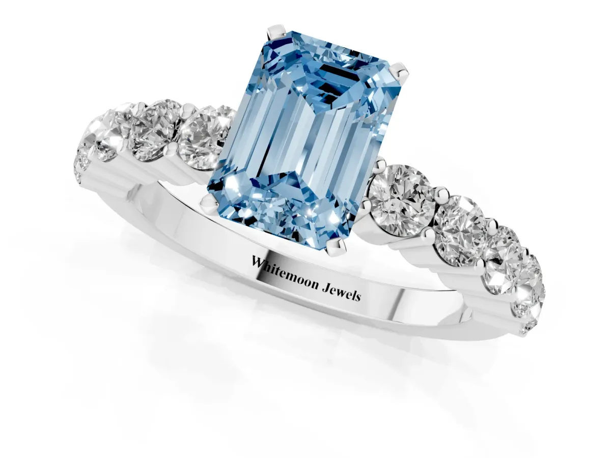 Fancy Blue Emerald Cut Diamond Solitaire Ring with Shared Prong Round Side Stones Platinum
