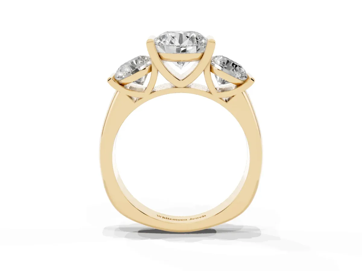 Three-Stone Round Cut Brilliant Diamond Ring with Channel Setting and White Gold Band Yellow gold