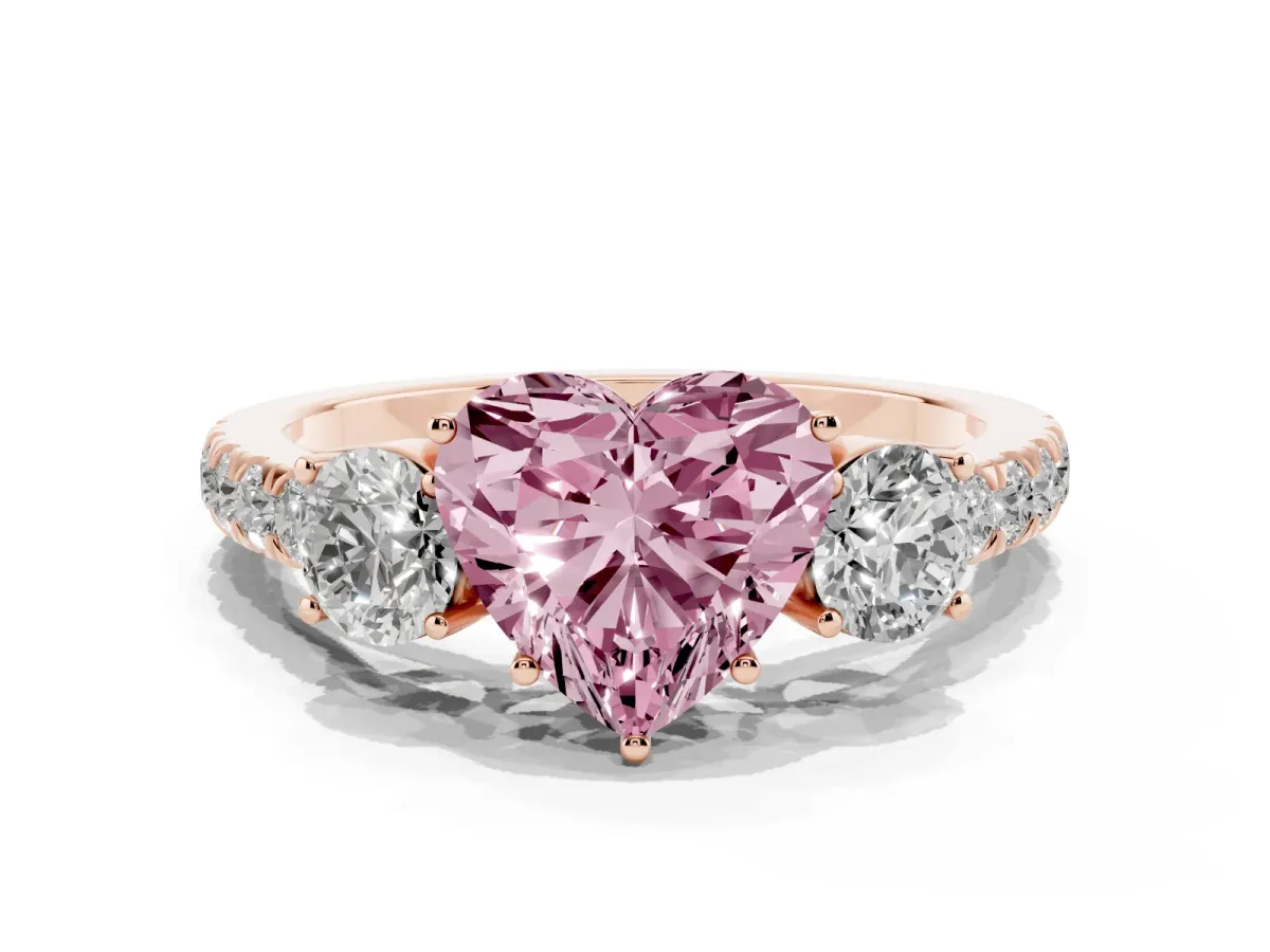 Fancy Pink Heart Cut Cut Diamond Three-Stone Ring with Round Side Stones and Pavé Band Rose gold