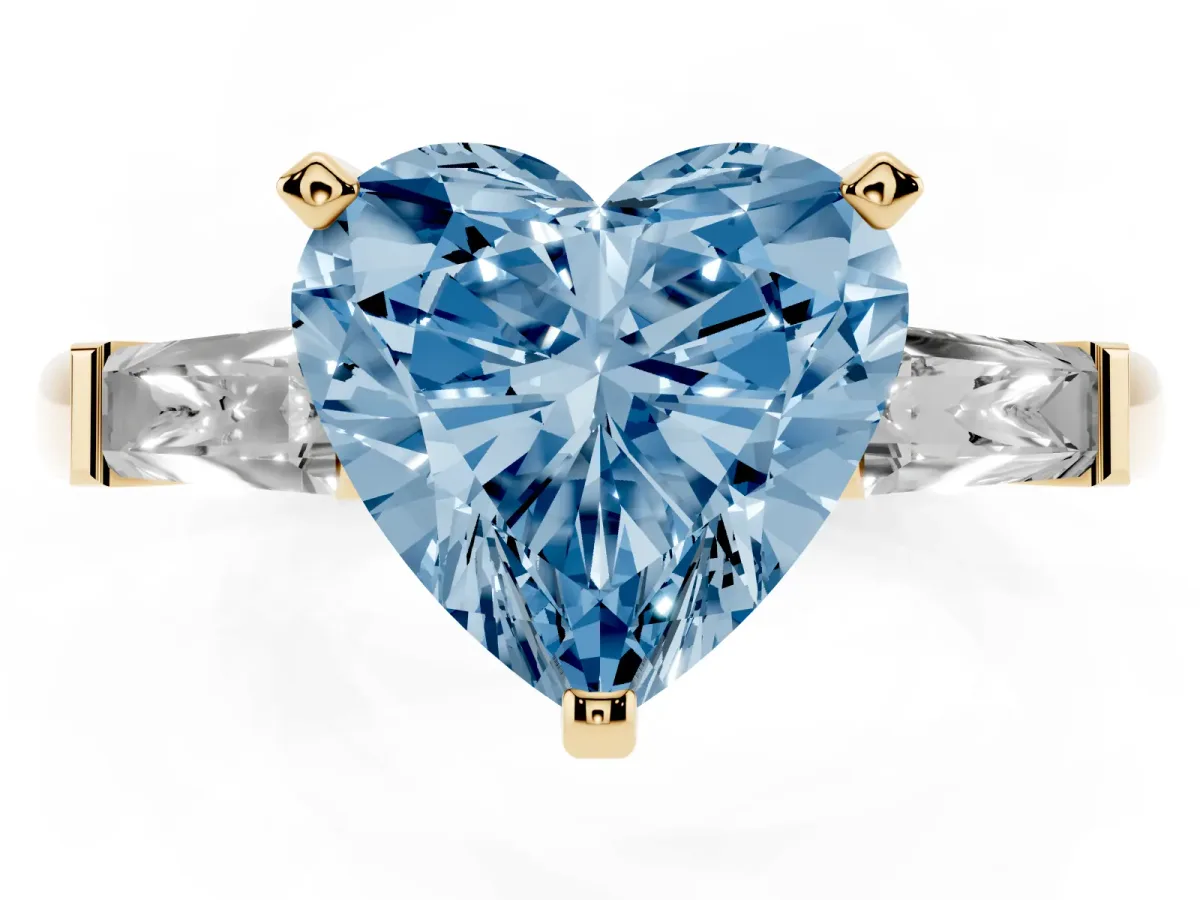 Fancy Blue Heart Cut Solitaire with Tapered Baguette Side Stones on a Classic Band with Four-Prong Setting Yellow gold