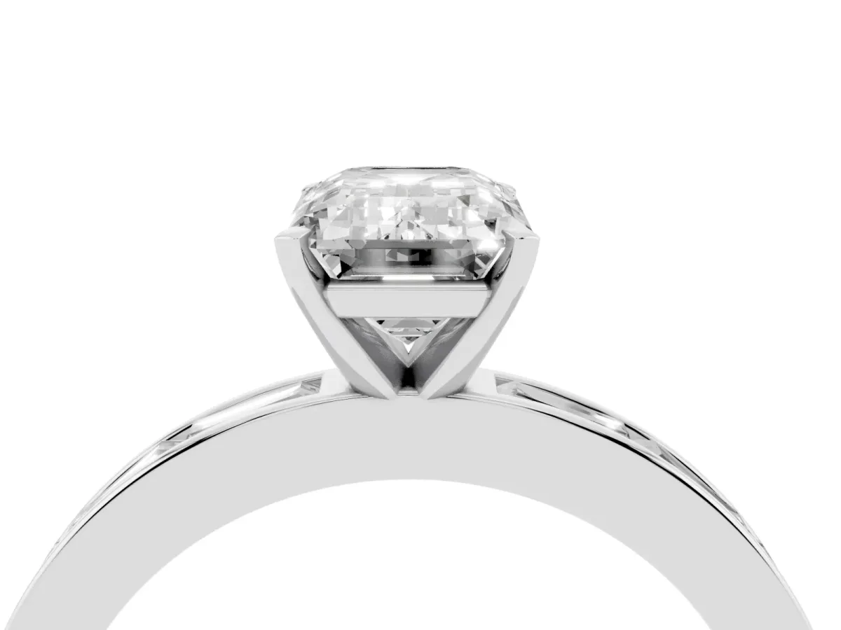 Emerald Cut Solitaire Diamond Ring with Channel-Set Baguette Band and Four-Prong Setting Silver