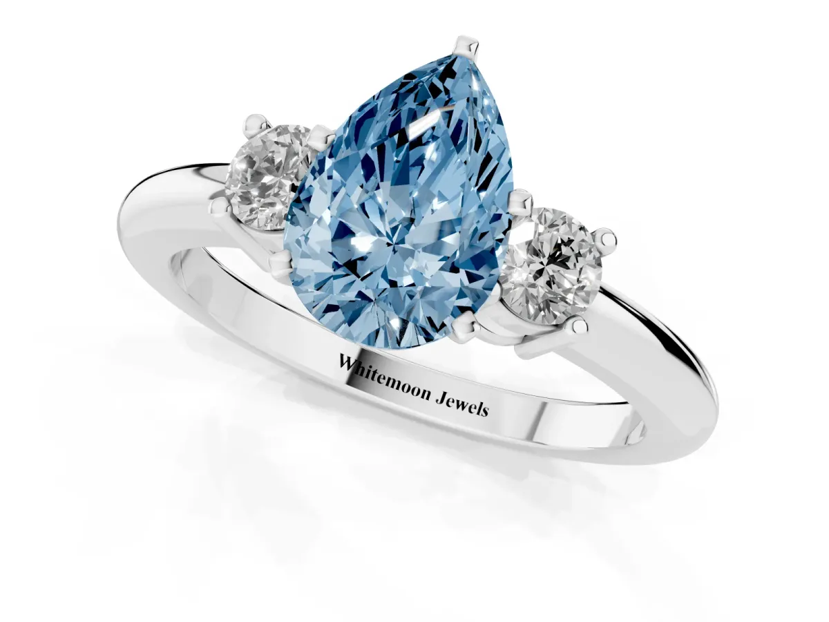 Fancy Blue Three-Stone Pear Cut Cut Diamond Solitaire with Prong Setting and Classic Band Silver