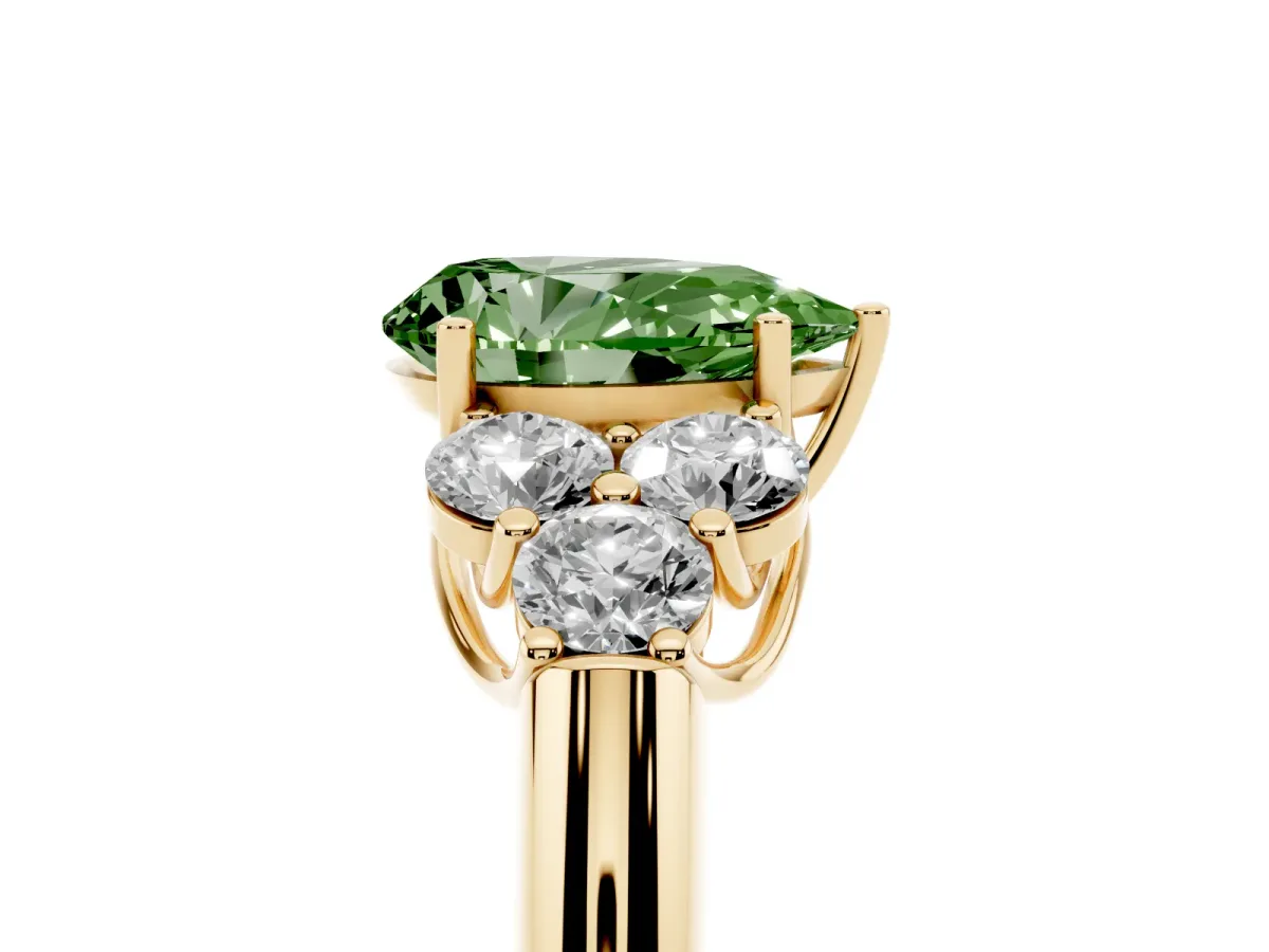 Fancy Green Pear Cut Cut Diamond Cluster Ring with Round Accent Stones and Prong Setting on a Classic Band Yellow gold