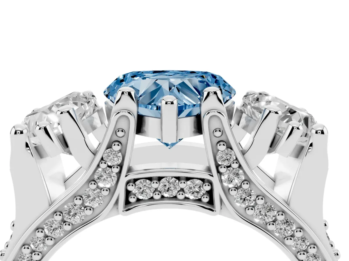 Fancy Blue Heart Cut Diamond Three-Stone Ring with Channel Set Band and Four-Prong Setting Silver
