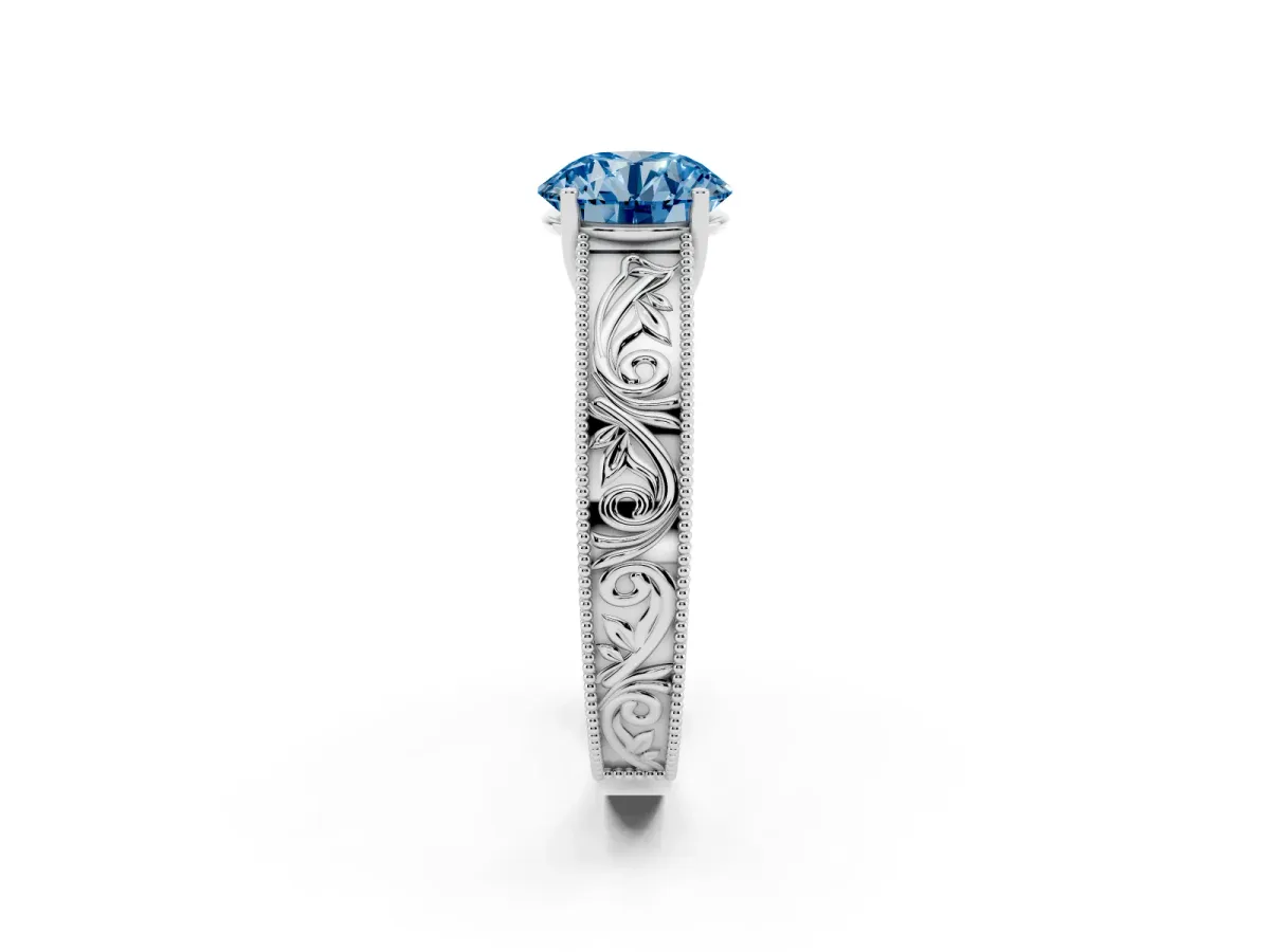 Fancy Blue Round Cut Diamond Solitaire Ring with Engraved Band and Four-Prong Setting White gold