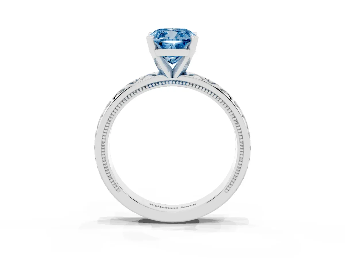 Fancy Blue Cushion Cut Solitaire Diamond Engagement Ring with XO Engraved Band and Four-Prong Setting White gold