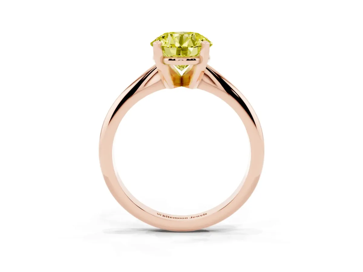 Fancy Yellow Round Cut Cut Solitaire Ring with Four-Prong Setting on a Classic Band Rose gold