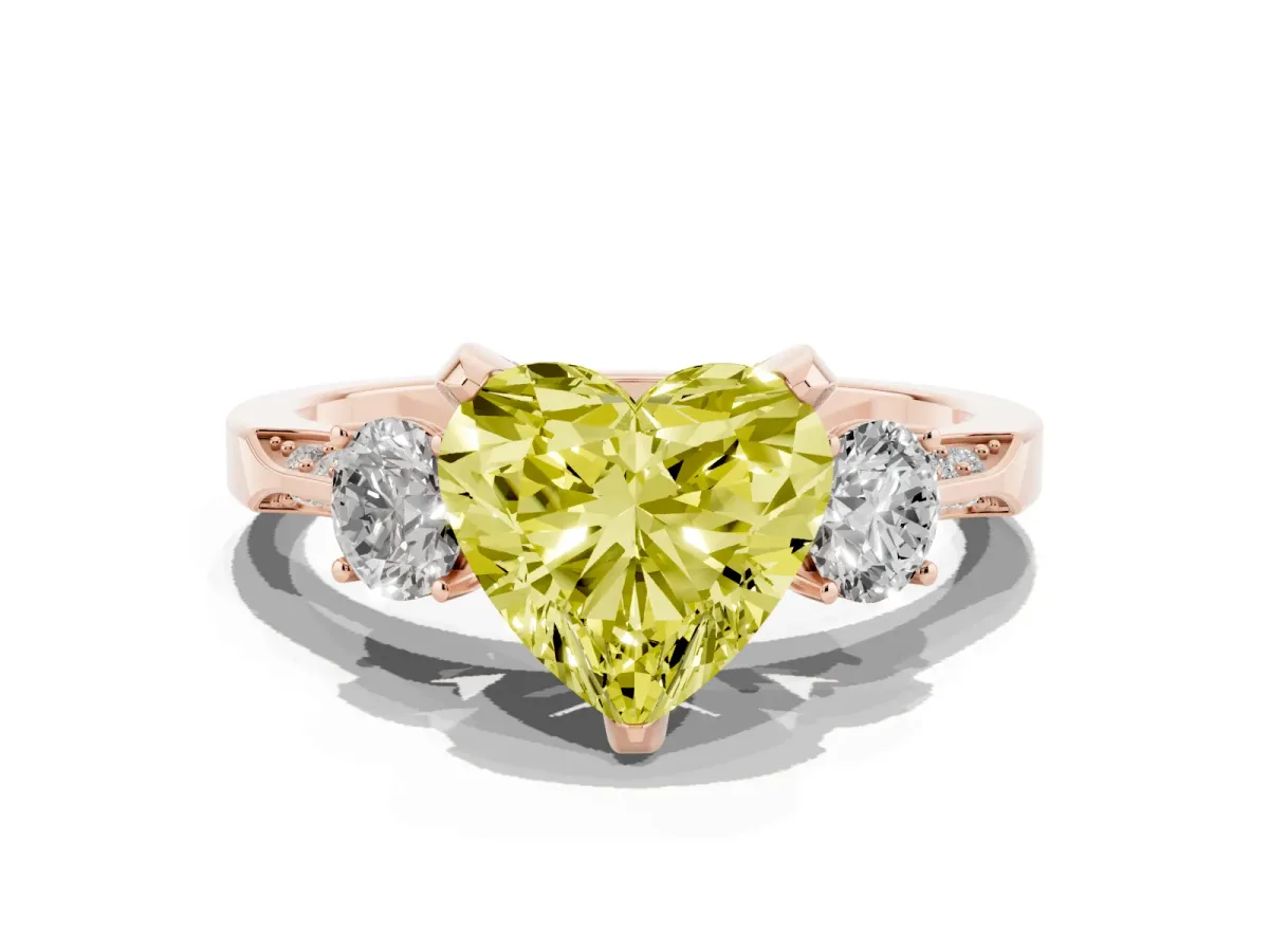 Fancy Yellow Heart Cut Brilliant Three-Stone Diamond Ring with Pavé Band and Four-Prong Setting Rose gold