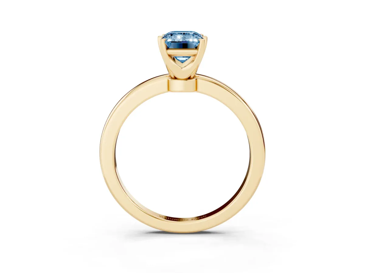 Fancy Blue Emerald Cut Solitaire Diamond Ring with Six-Prong Setting on a Classic Band Yellow gold