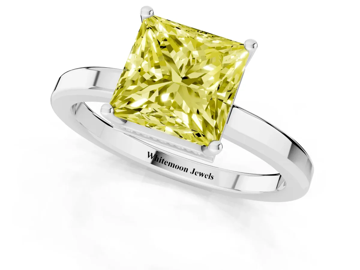 Fancy Yellow Princess Cut Cut Solitaire Engagement Ring with Four-Prong Setting on a Classic Band Platinum