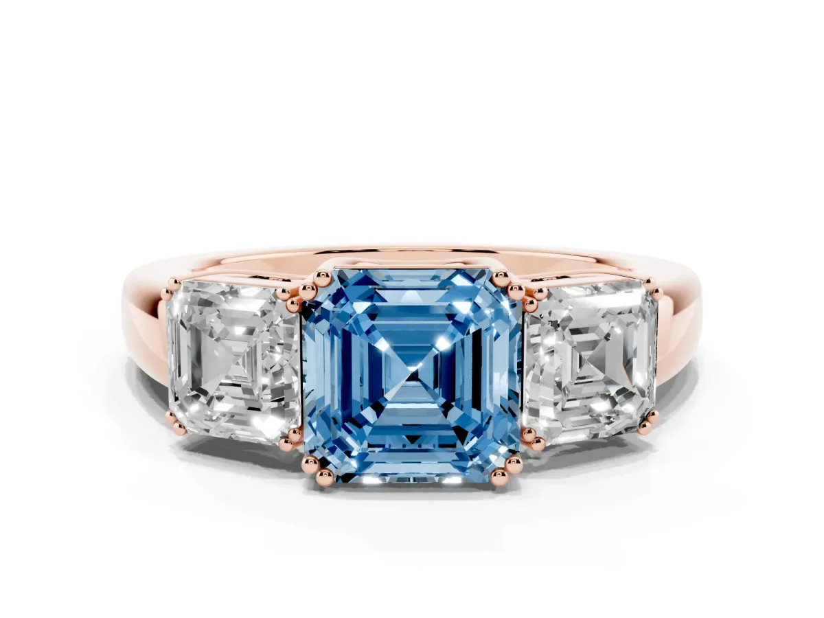 Fancy Blue Three-Stone Asscher Cut Cut Diamond Ring with Channel Set Band and Four-Prong Setting Rose gold