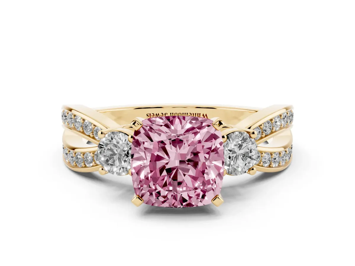 Fancy Pink Three-Stone Cushion Cut Cut Diamond Twist Band with Prong Setting Yellow gold