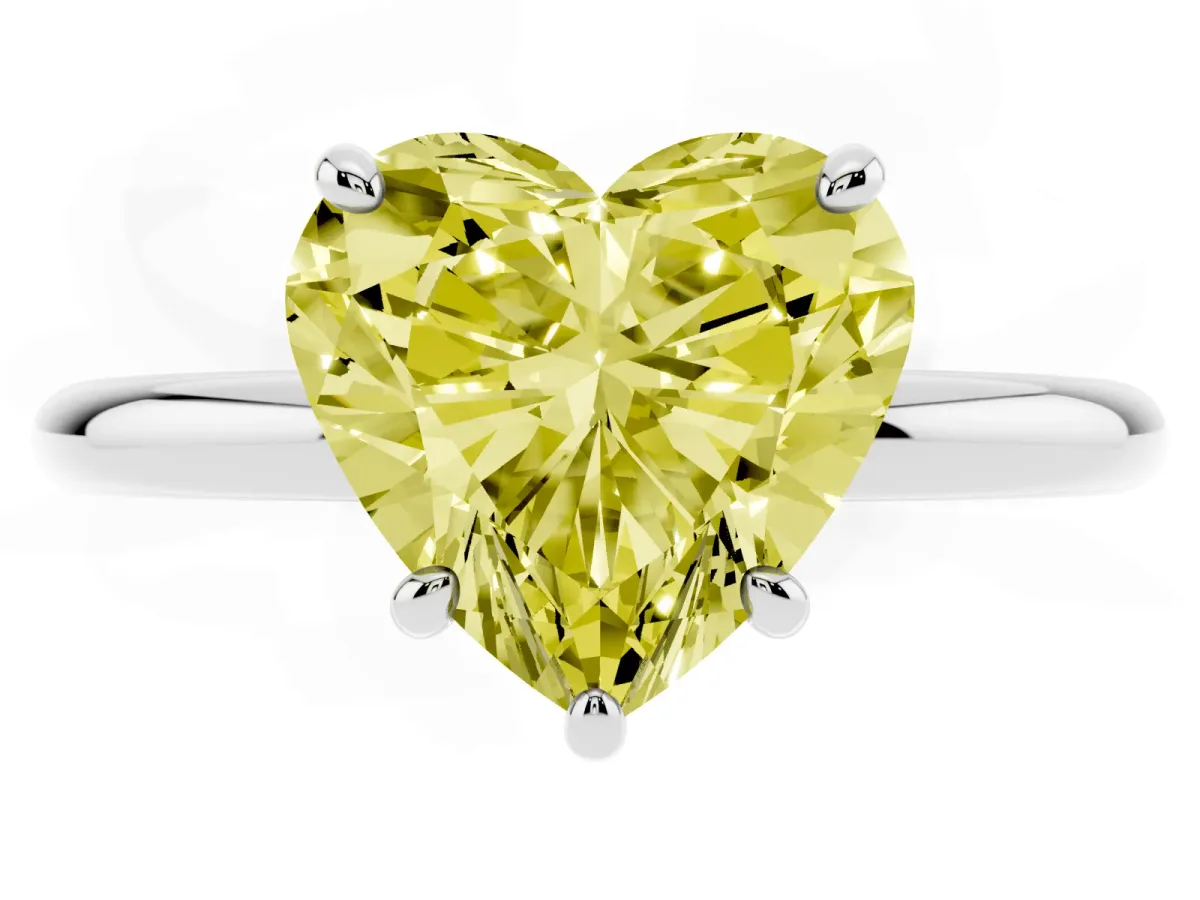 Fancy Yellow Heart Cut Solitaire Diamond Ring with Four-Prong Setting on a Plain Band Platinum